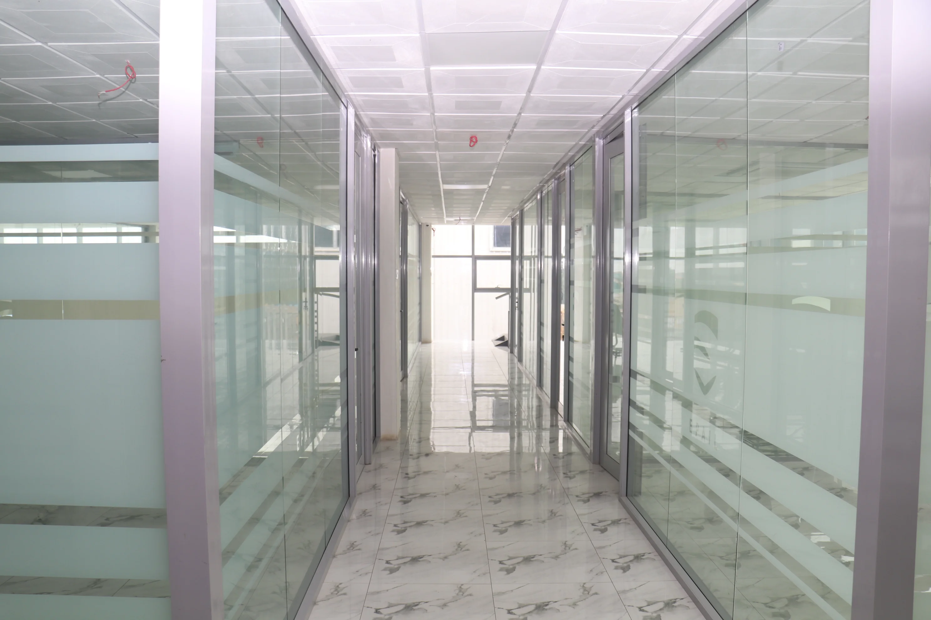 Frameless glass office partition workspace
